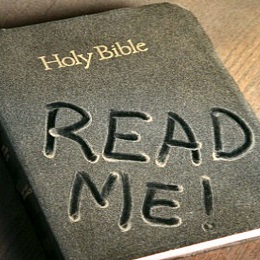 Bible with dust on, says read me.